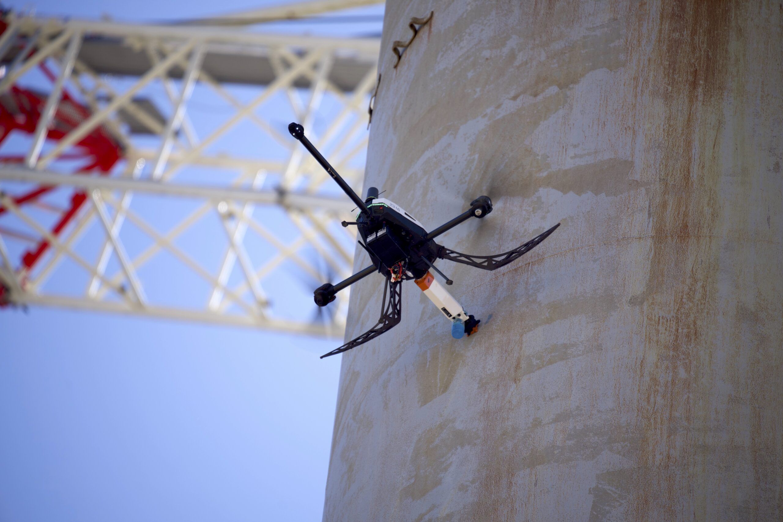 Gravity-defying. Voliro T drone testing wall thickness with ultrasonics