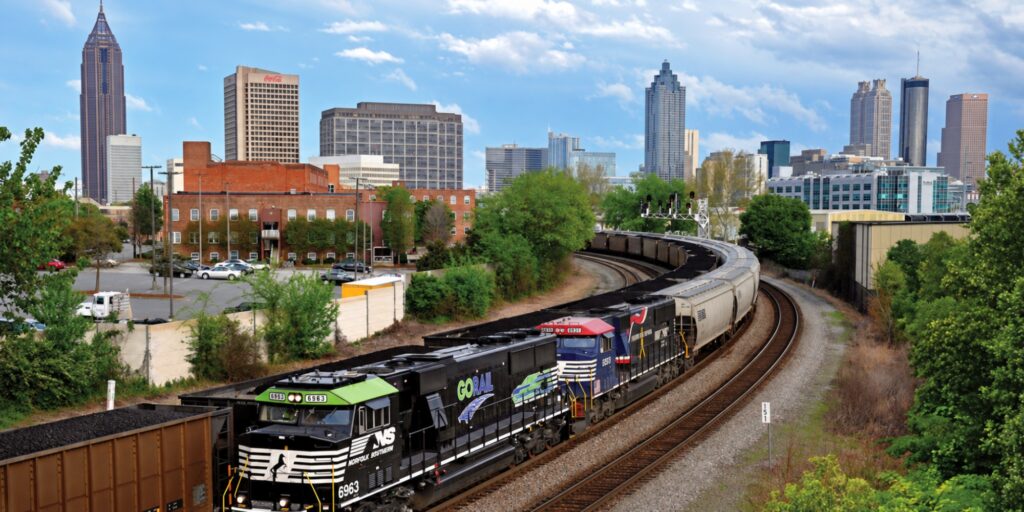 Picture of metro Atlanta with train and skyscrapers in background (hero image)