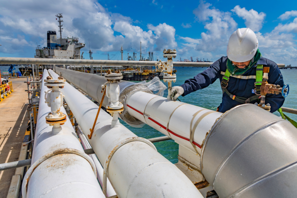 Technician performing an NDT inspection on a maritime structural asset