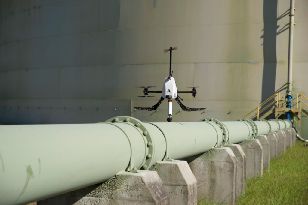 Technician inspecting process or utility equipment